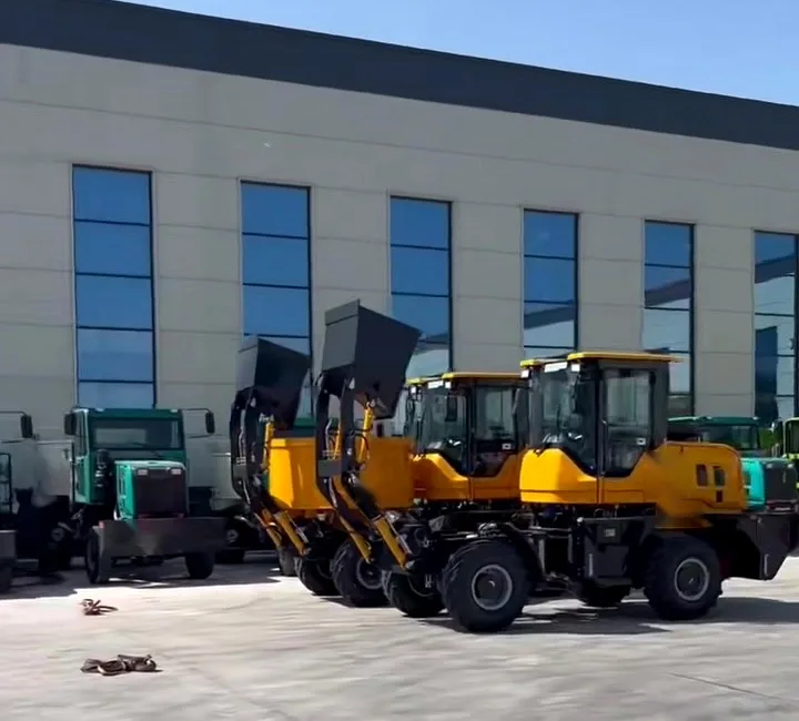 Three self-loading concrete mixers of the same build parked in a line outside an assembly hall, loading buckets raised